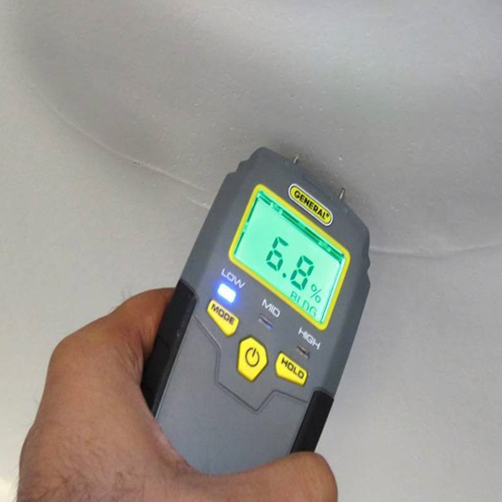 Moisture meter showing percent of moisture in a wall